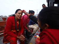 A Nepali Hindu receives a multi-colored tika on the forehead, marking the day of Bhaitika, the concluding day of Tihar, the five-day festiva...