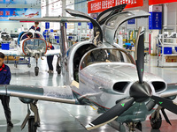 Workers assemble an aircraft at Qingdao Wanfeng Diamond Aircraft Manufacturing Co LTD in Laixi, China, on November 3, 2024. (