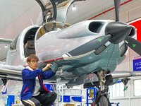 Workers assemble an aircraft at Qingdao Wanfeng Diamond Aircraft Manufacturing Co LTD in Laixi, China, on November 3, 2024. (