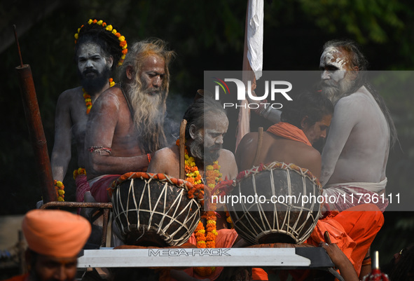 Indian Sadhus of Juna Akhara take part in a religious procession during the grand Nagar Pravesh ceremony for the upcoming Maha Kumbh Mela fe...