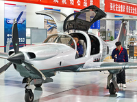 Workers assemble an aircraft at Qingdao Wanfeng Diamond Aircraft Manufacturing Co LTD in Laixi, China, on November 3, 2024. (