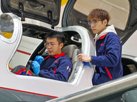 Workers adjust an aircraft at Qingdao Wanfeng Diamond Aircraft Manufacturing Co LTD in Laixi, China, on November 3, 2024. (