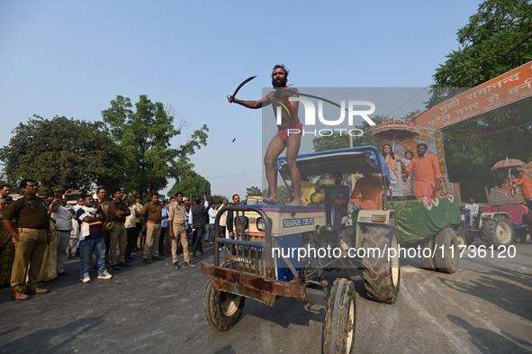 Indian Sadhus of Juna Akhara take part in a religious procession during the grand Nagar Pravesh ceremony for the upcoming Maha Kumbh Mela fe...