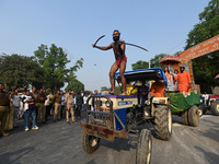 Indian Sadhus of Juna Akhara take part in a religious procession during the grand Nagar Pravesh ceremony for the upcoming Maha Kumbh Mela fe...