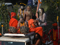 Indian Sadhus of Juna Akhara take part in a religious procession during the grand Nagar Pravesh ceremony for the upcoming Maha Kumbh Mela fe...