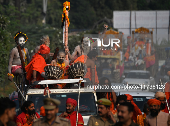 Indian Sadhus of Juna Akhara take part in a religious procession during the grand Nagar Pravesh ceremony for the upcoming Maha Kumbh Mela fe...