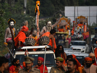 Indian Sadhus of Juna Akhara take part in a religious procession during the grand Nagar Pravesh ceremony for the upcoming Maha Kumbh Mela fe...