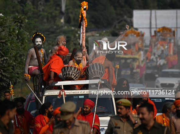 Indian Sadhus of Juna Akhara take part in a religious procession during the grand Nagar Pravesh ceremony for the upcoming Maha Kumbh Mela fe...