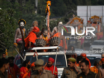 Indian Sadhus of Juna Akhara take part in a religious procession during the grand Nagar Pravesh ceremony for the upcoming Maha Kumbh Mela fe...