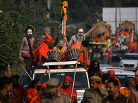 Indian Sadhus of Juna Akhara take part in a religious procession during the grand Nagar Pravesh ceremony for the upcoming Maha Kumbh Mela fe...