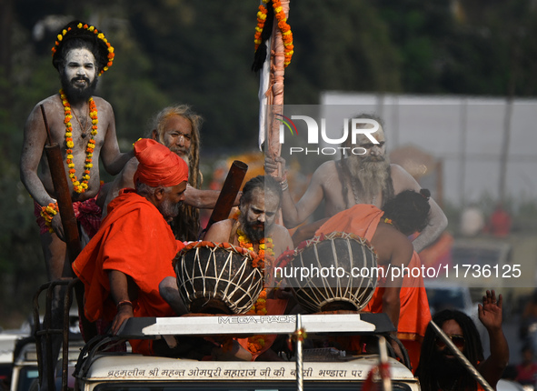 Indian Sadhus of Juna Akhara take part in a religious procession during the grand Nagar Pravesh ceremony for the upcoming Maha Kumbh Mela fe...