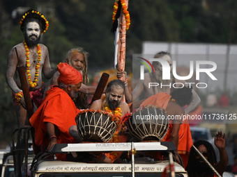 Indian Sadhus of Juna Akhara take part in a religious procession during the grand Nagar Pravesh ceremony for the upcoming Maha Kumbh Mela fe...