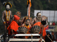 Indian Sadhus of Juna Akhara take part in a religious procession during the grand Nagar Pravesh ceremony for the upcoming Maha Kumbh Mela fe...