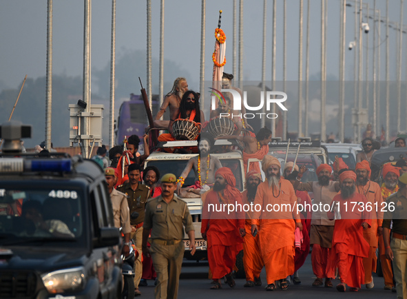 Indian Sadhus of Juna Akhara take part in a religious procession during the grand Nagar Pravesh ceremony for the upcoming Maha Kumbh Mela fe...