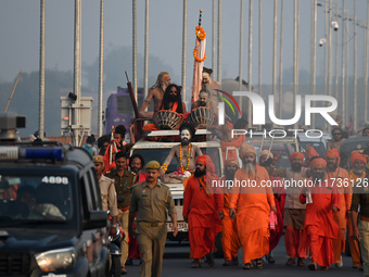 Indian Sadhus of Juna Akhara take part in a religious procession during the grand Nagar Pravesh ceremony for the upcoming Maha Kumbh Mela fe...