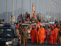 Indian Sadhus of Juna Akhara take part in a religious procession during the grand Nagar Pravesh ceremony for the upcoming Maha Kumbh Mela fe...