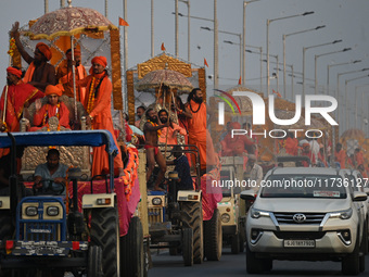 Indian Sadhus of Juna Akhara take part in a religious procession during the grand Nagar Pravesh ceremony for the upcoming Maha Kumbh Mela fe...