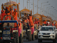 Indian Sadhus of Juna Akhara take part in a religious procession during the grand Nagar Pravesh ceremony for the upcoming Maha Kumbh Mela fe...