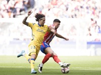 In Madrid, Spain, on November 3, Lenglet of Atletico de Madrid and Fabio Silva of Las Palmas fight for the ball during the La Liga 2024/25 m...