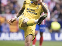 Viti Rozada of Las Palmas attempts a shot during the La Liga 2024/25 match between Atletico de Madrid and Las Palmas at Riyadh Air Metropoli...