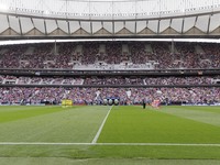 In Madrid, Spain, on November 3, players from Atletico de Madrid and Las Palmas show respect for the victims of the Valencia rains during th...