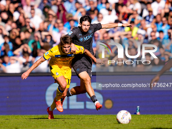 Khvicha Kvaratskhelia of SSC Napoli and Charles De Ketelaere of Atalanta BC compete for the ball during the serie Serie A Enilive match betw...