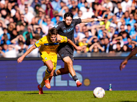 Khvicha Kvaratskhelia of SSC Napoli and Charles De Ketelaere of Atalanta BC compete for the ball during the serie Serie A Enilive match betw...