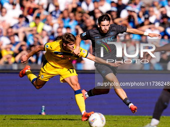 Khvicha Kvaratskhelia of SSC Napoli and Charles De Ketelaere of Atalanta BC compete for the ball during the serie Serie A Enilive match betw...