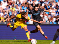 Khvicha Kvaratskhelia of SSC Napoli and Charles De Ketelaere of Atalanta BC compete for the ball during the serie Serie A Enilive match betw...