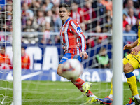 Giuliano Simeone of Atletico de Madrid shows the ball of his goal during the La Liga EA Sports 2024/25 football match between Atletico de Ma...