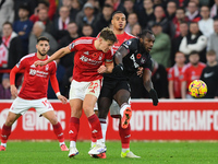 Ryan Yates of Nottingham Forest battles with Michail Antonio of West Ham United during the Premier League match between Nottingham Forest an...