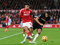 Morgan Gibbs-White of Nottingham Forest battles with Lucas Paqueta of West Ham United during the Premier League match between Nottingham For...