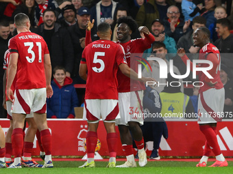 Ola Aina of Nottingham Forest celebrates with Murillo of Nottingham Forest after scoring a goal to make it 3-0 during the Premier League mat...