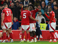 Ola Aina of Nottingham Forest celebrates with Murillo of Nottingham Forest after scoring a goal to make it 3-0 during the Premier League mat...