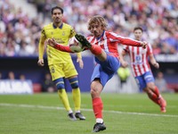 In Madrid, Spain, on November 3, Antoine Griezmann of Atletico de Madrid attempts a shot during the La Liga 2024/25 match between Atletico d...