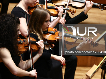 Violonists perform during Eufonie Fesrival at the ICE Congress Center in Krakow, Poland on November 2, 2024. (