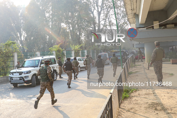 Indian paramilitary troops run towards the site of a grenade explosion in Srinagar, Indian-administered Kashmir, on November 3, 2024. Ten pe...