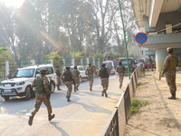 Indian paramilitary troops run towards the site of a grenade explosion in Srinagar, Indian-administered Kashmir, on November 3, 2024. Ten pe...