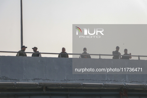 Indian police forces stand alert at the site of a grenade explosion in Srinagar, Indian-administered Kashmir, on November 3, 2024. Ten peopl...