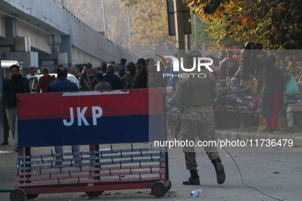 Indian paramilitary troops patrol near the site of a grenade explosion in Srinagar, Indian-administered Kashmir, on November 3, 2024. Ten pe...