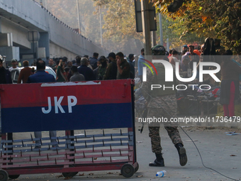 Indian paramilitary troops patrol near the site of a grenade explosion in Srinagar, Indian-administered Kashmir, on November 3, 2024. Ten pe...