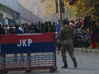 Indian paramilitary troops patrol near the site of a grenade explosion in Srinagar, Indian-administered Kashmir, on November 3, 2024. Ten pe...