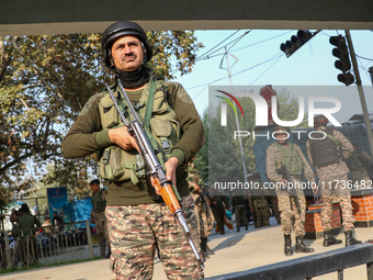 Indian paramilitary troops remain on alert near the site of a grenade explosion in Srinagar, Indian-administered Kashmir, on November 3, 202...