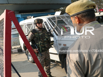 Indian paramilitary troops remain on alert near the site of a grenade explosion in Srinagar, Indian-administered Kashmir, on November 3, 202...