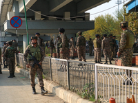 Indian paramilitary troops remain on alert near the site of a grenade explosion in Srinagar, Indian-administered Kashmir, on November 3, 202...