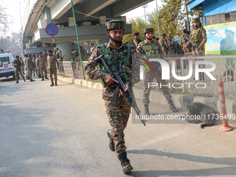 Indian paramilitary troops run towards the site of a grenade explosion in Srinagar, Indian-administered Kashmir, on November 3, 2024. Ten pe...