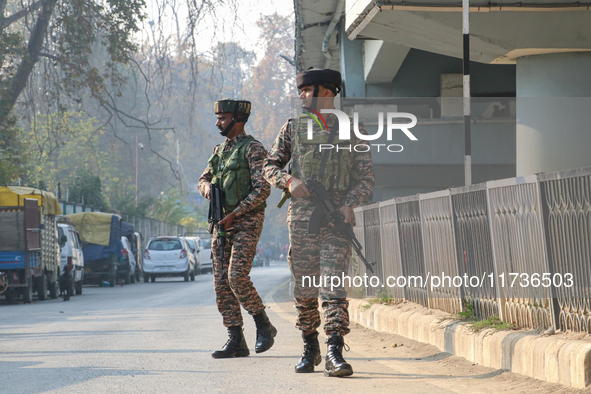 Indian paramilitary troops patrol near the site of a grenade explosion in Srinagar, Indian-administered Kashmir, on November 3, 2024. Ten pe...