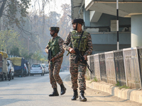 Indian paramilitary troops patrol near the site of a grenade explosion in Srinagar, Indian-administered Kashmir, on November 3, 2024. Ten pe...