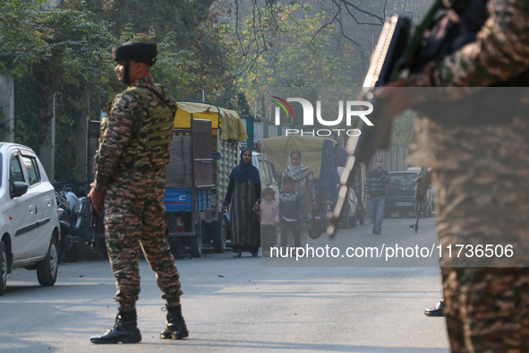 Indian paramilitary troops remain on alert near the site of a grenade explosion in Srinagar, Indian-administered Kashmir, on November 3, 202...