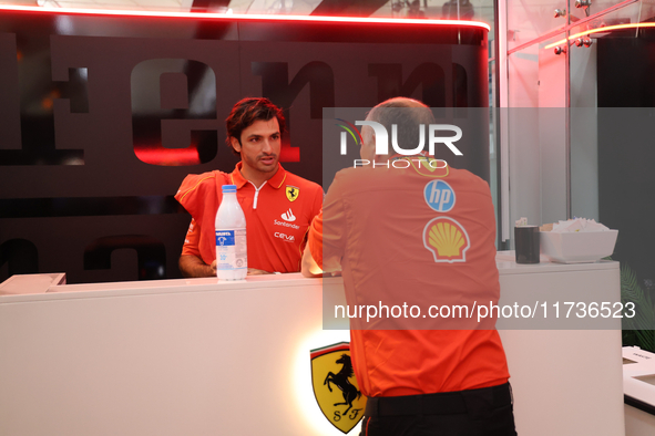 Carlos Sainz Jr. of Spain drives the (55) Scuderia Ferrari SF-24 Ferrari, and Frederic Vasseur, Team Principal of Scuderia Ferrari, during t...